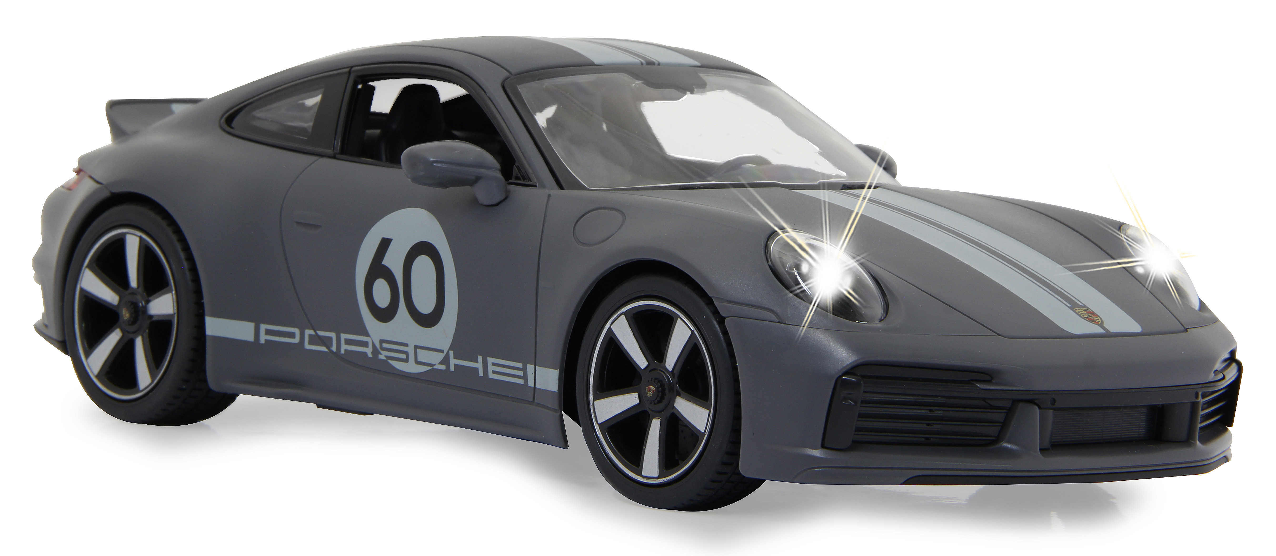 Graues Porsche-Sportwagen-Spielzeug. Hat die Zahl '60' und weiße Streifen. Scheinwerfer sind an.