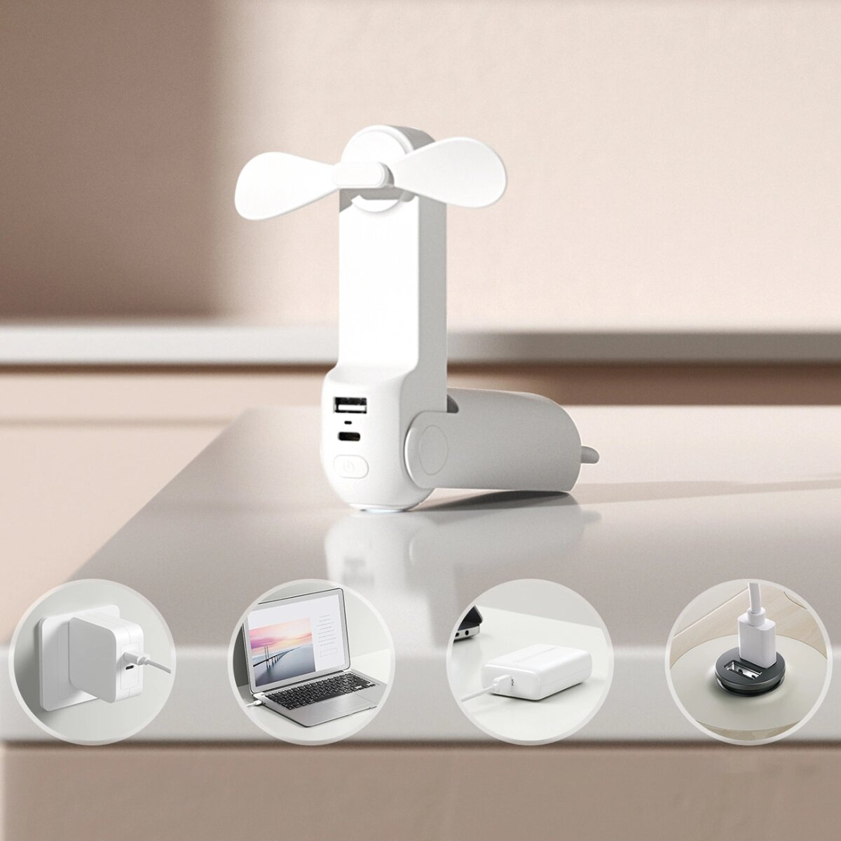 Ventilatore portatile bianco con porte USB e laptop, caricabatterie in cerchi su un tavolo.