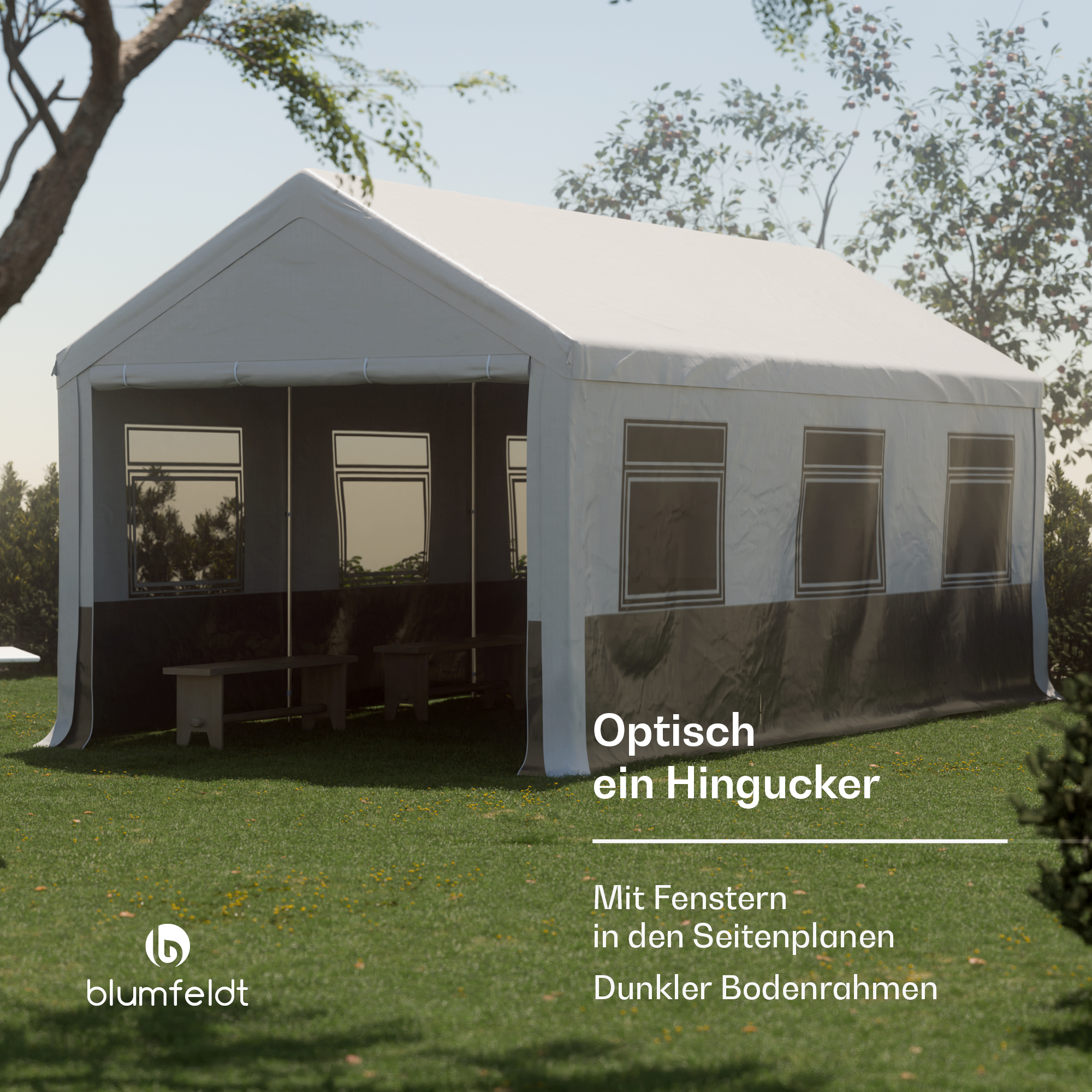 Ein weißes Zelt mit Fenstern auf Gras. Das Zelt hat eine dunkle Basis. Der Hintergrund zeigt Bäume.