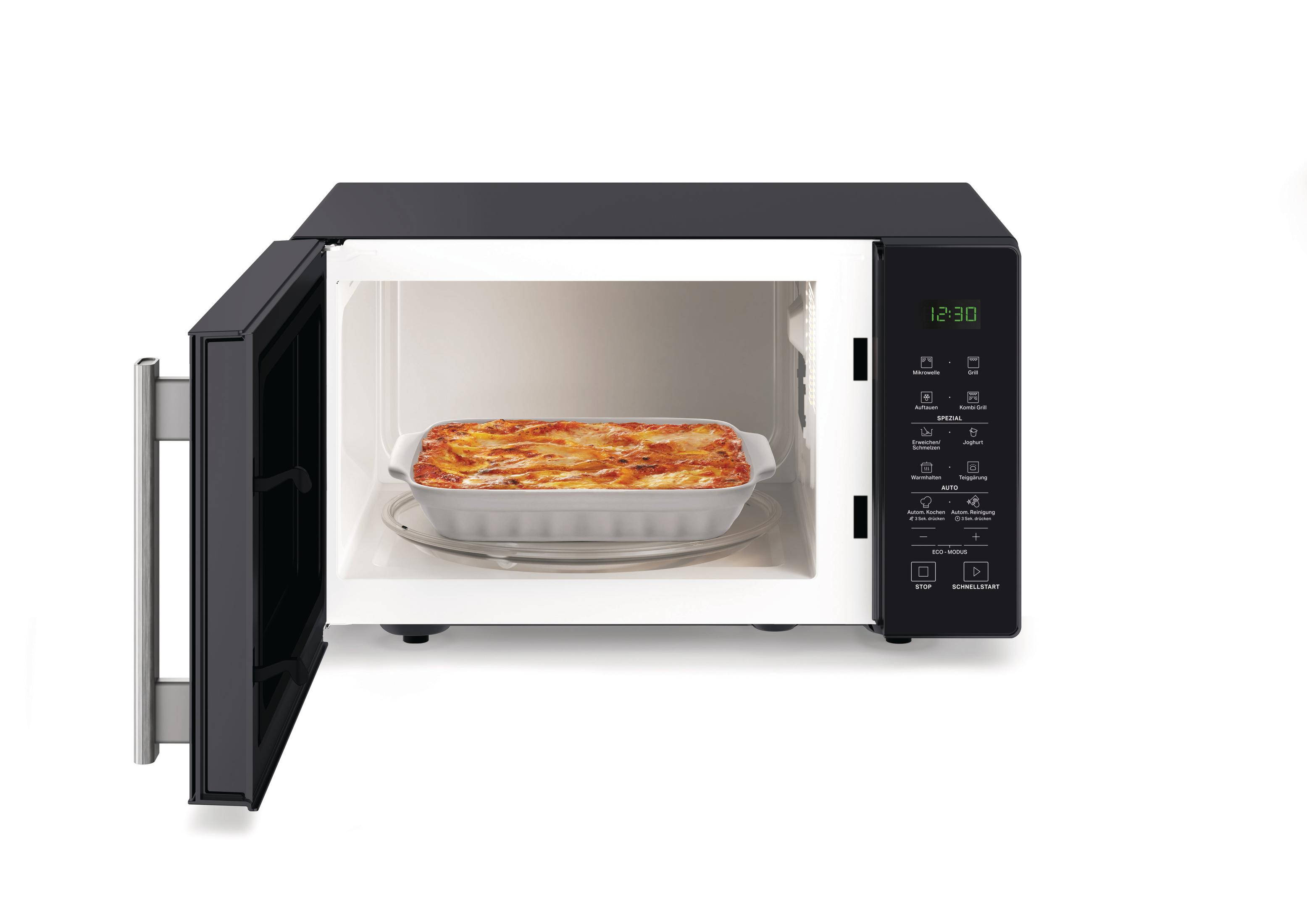 Eine offene Mikrowelle mit Lasagne auf einem Glasteller. Es ist 12:30 Uhr.