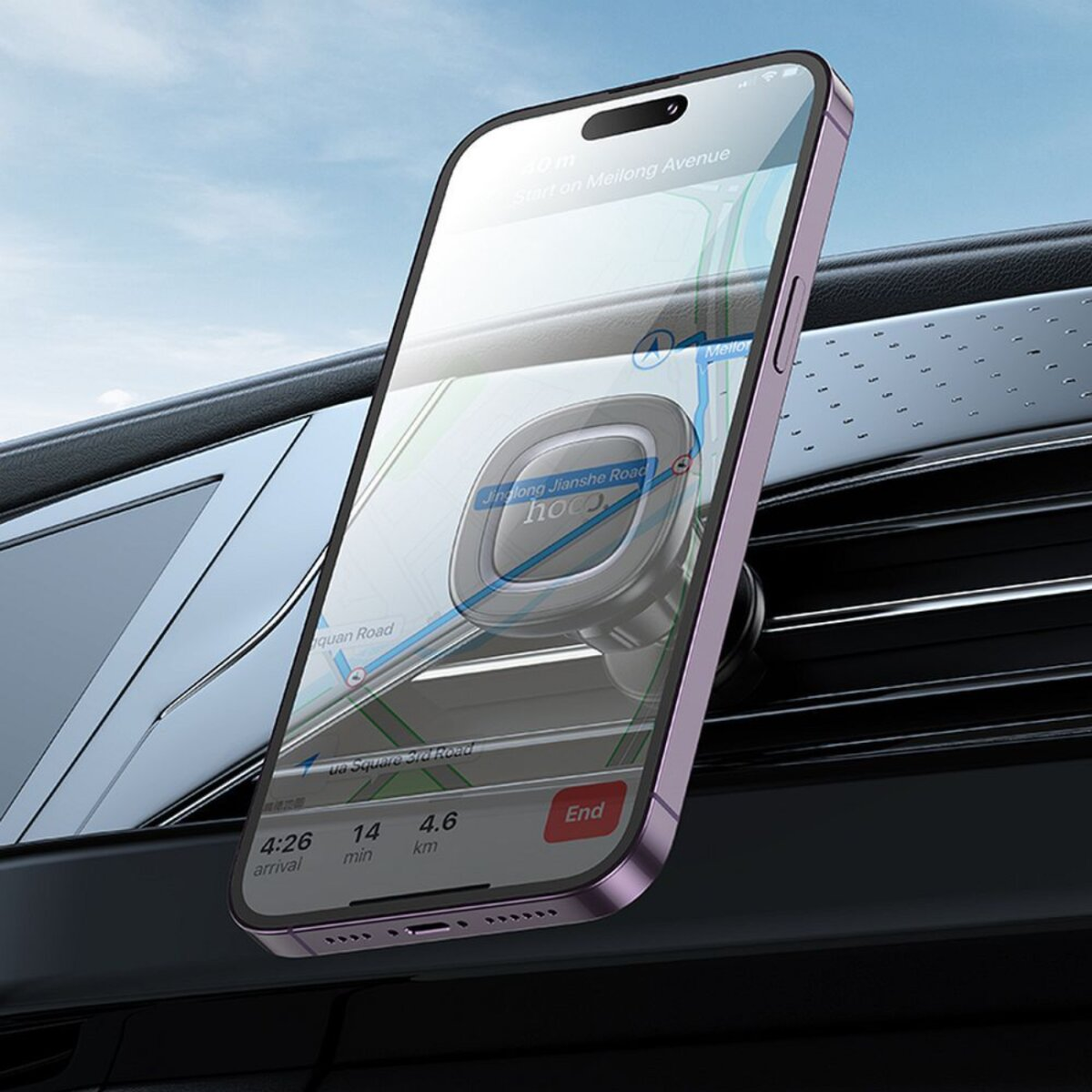 Een paarse telefoon is gemonteerd op een ventilatierooster van een auto. De telefoon toont een navigatiekaart.