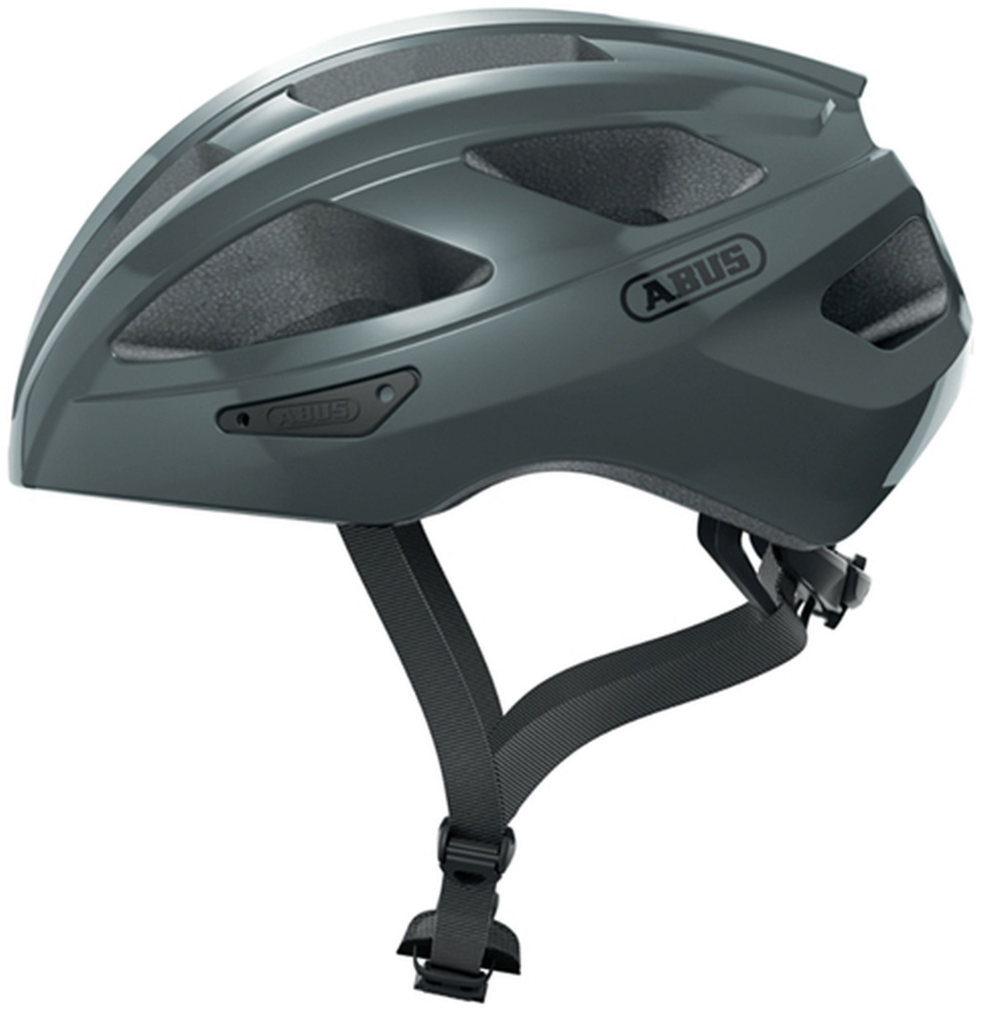 Ein grauer Fahrradhelm mit dem Wort 'ABUS' an der Seite und einem schwarzen Riemen.