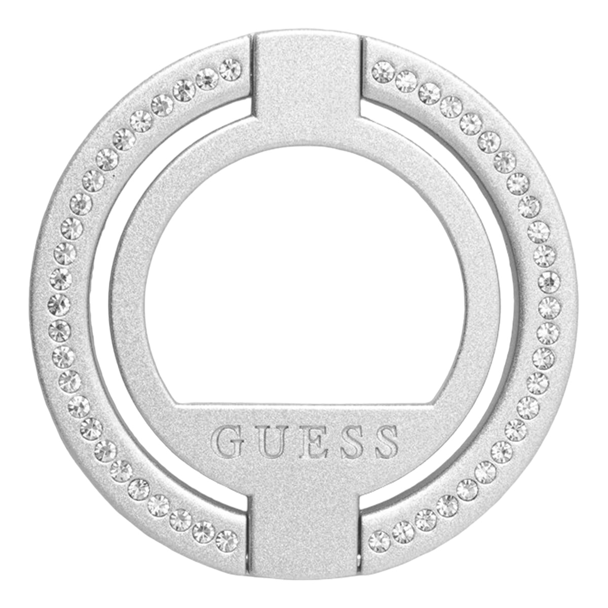 Une bague argentée avec le mot 'GUESS' gravé, entourée de cristaux. Gros plan sur fond blanc.