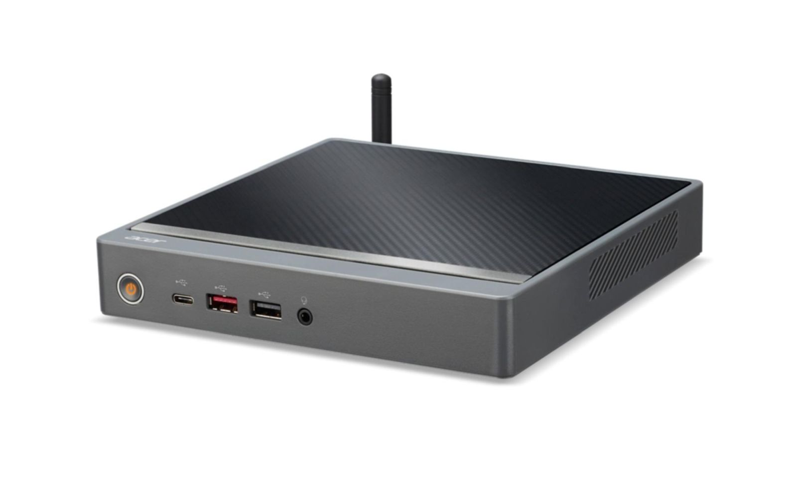 Mini PC grigio con un top nero, a motivi, porte e un'antenna. Logo Acer visibile. Lo sfondo è bianco.