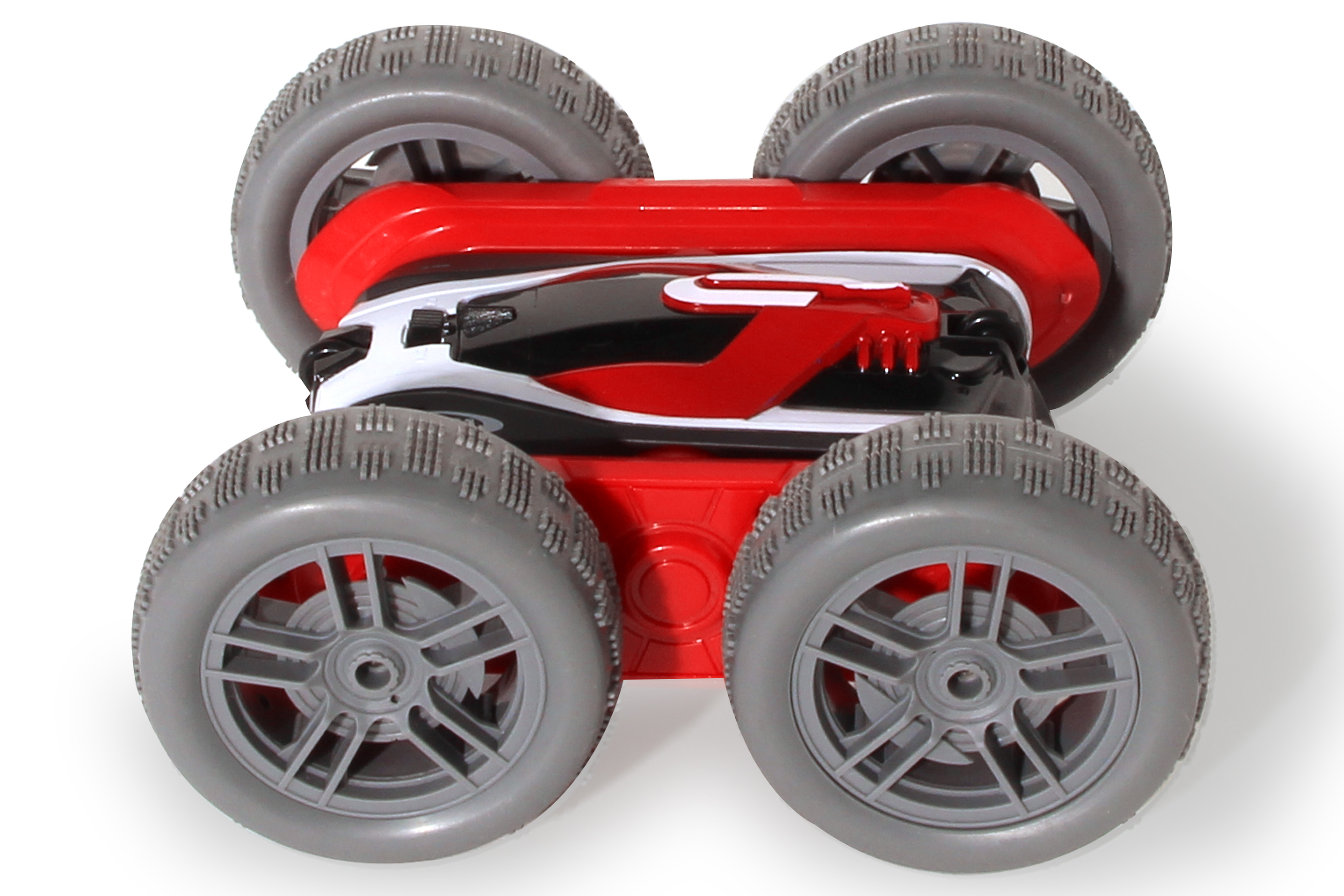 Ein rot-weiß-schwarzes Spielzeugauto mit grauen Rädern, beleuchteten Scheinwerfern und weißem Hintergrund.