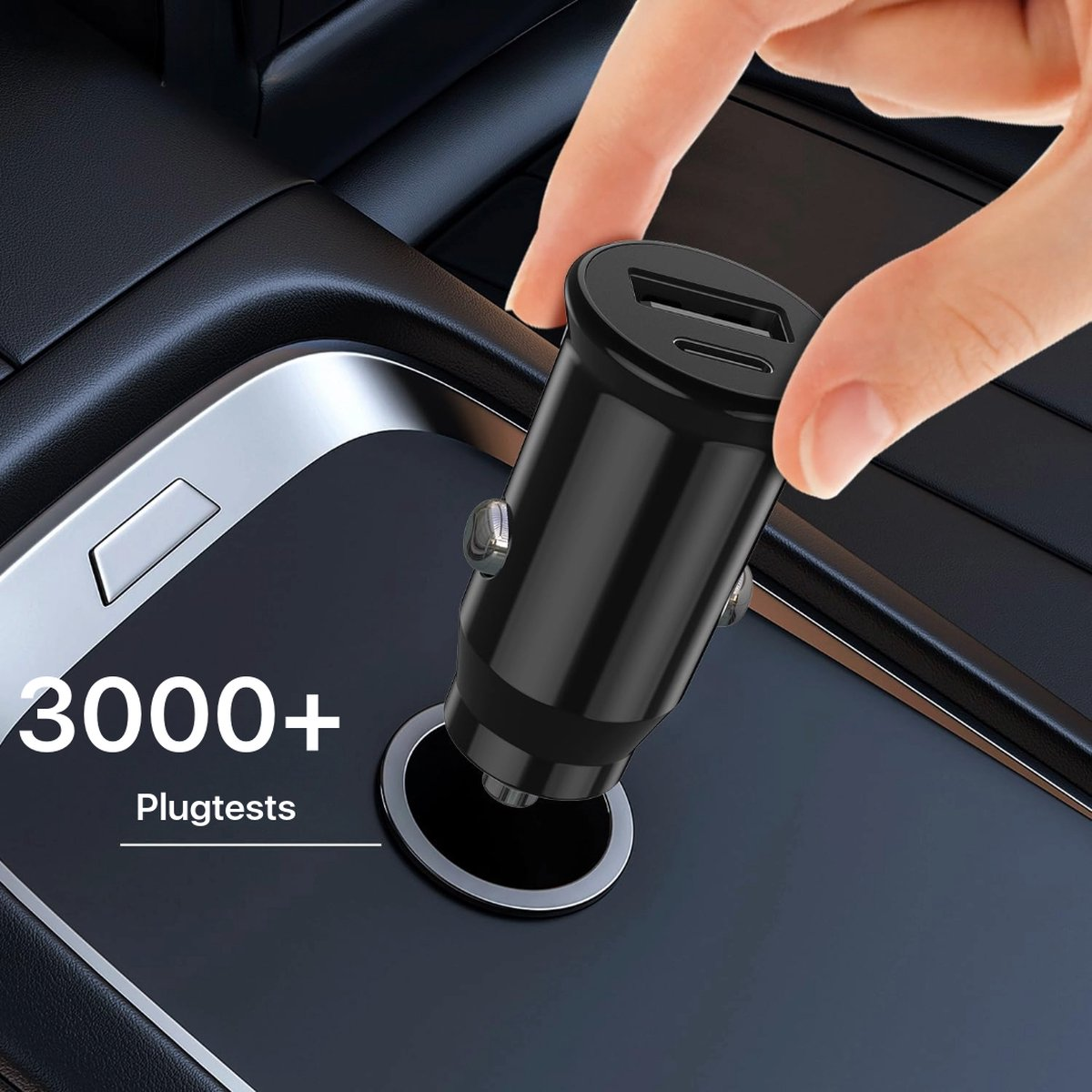A hand plugging a black car charger into a car. The charger has two USB ports.