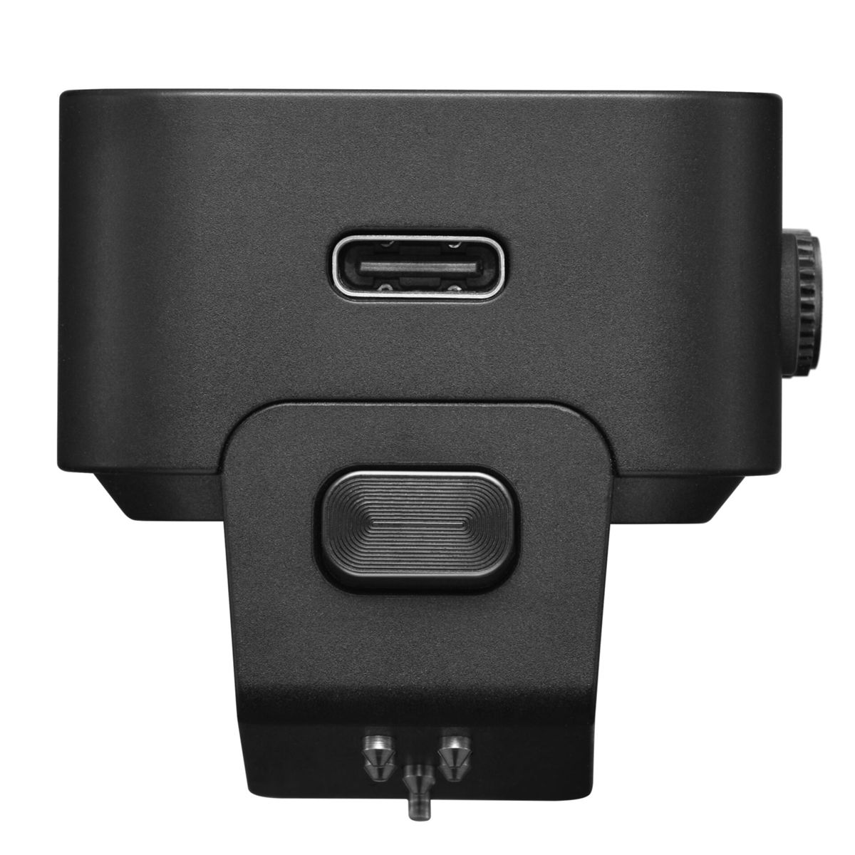 Gros plan d'un appareil électronique noir avec port USB et bouton. Le fond est blanc.
