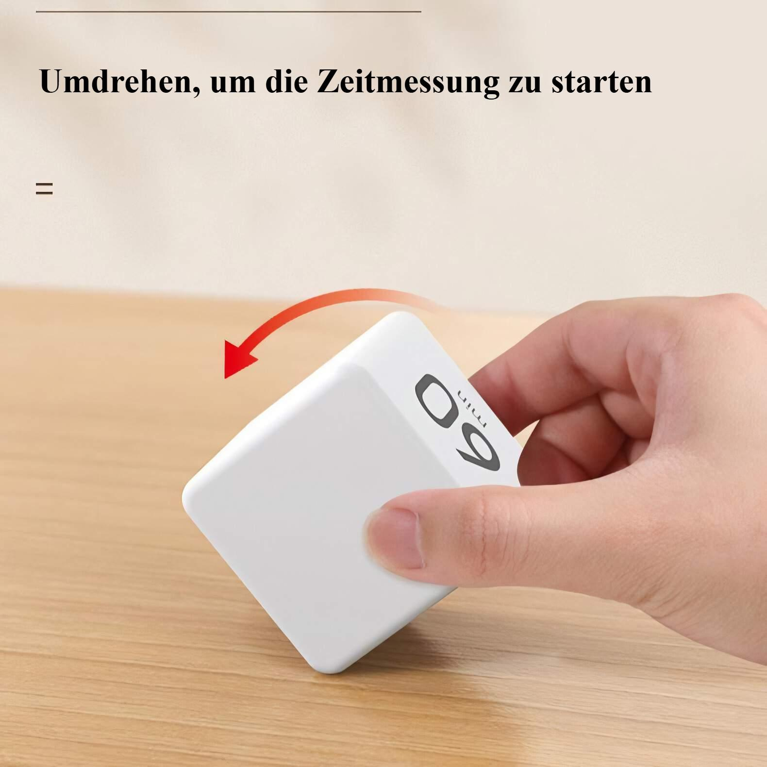 Ein weißer Würfel-Timer wird von einer Hand gehalten. Die Zahl 60 ist sichtbar. Ein Pfeil zeigt das Drehen des Würfels an.