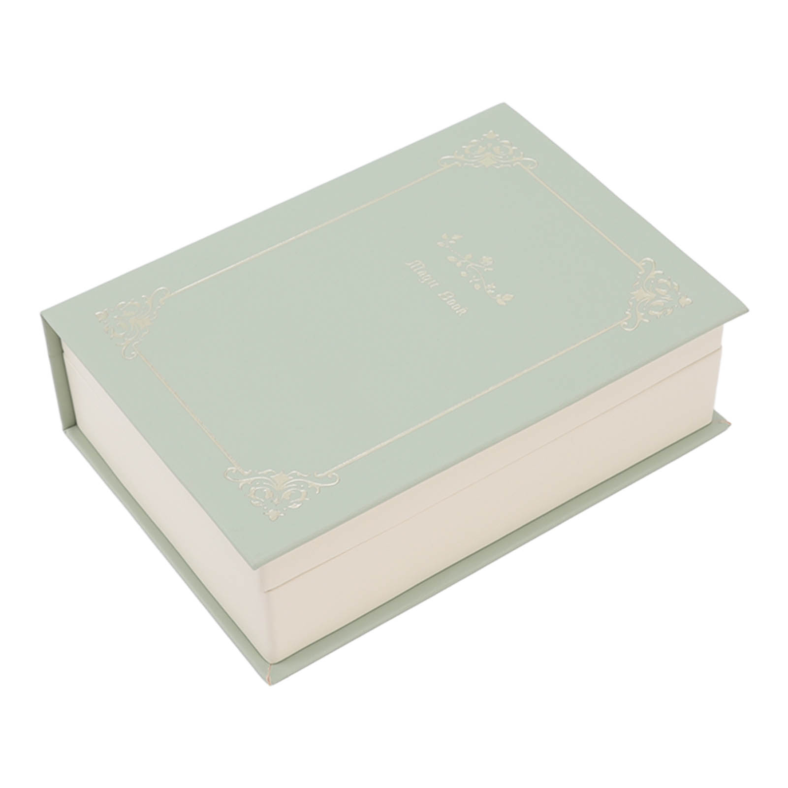 Eine geschlossene, hellgrüne „Magic Book“-Box mit goldenen floralen Eckdetails auf einer weißen Oberfläche.