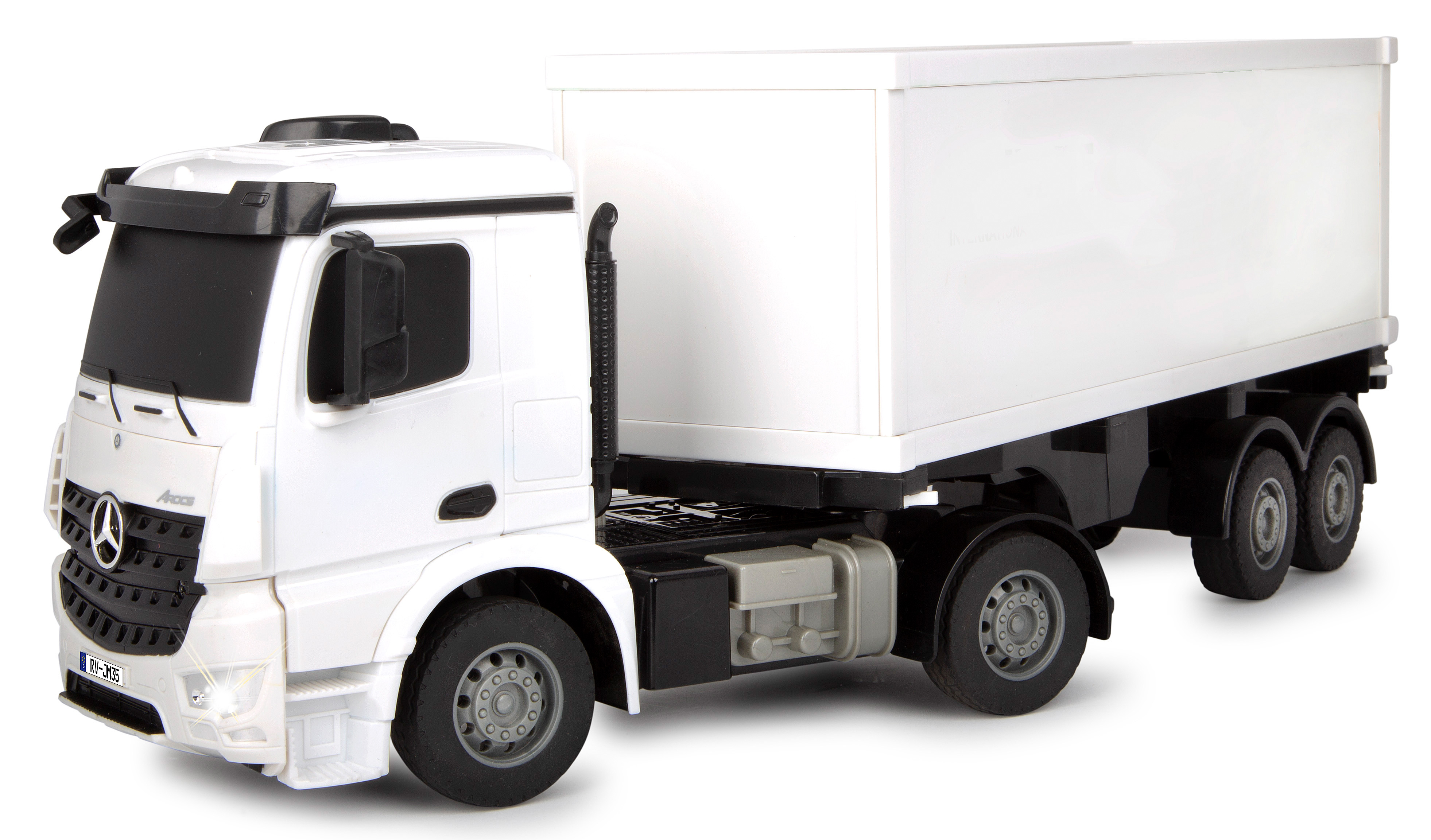 Weißer Spielzeug-LKW mit Anhänger. Der LKW hat ein Mercedes-Logo und schwarze Räder.
