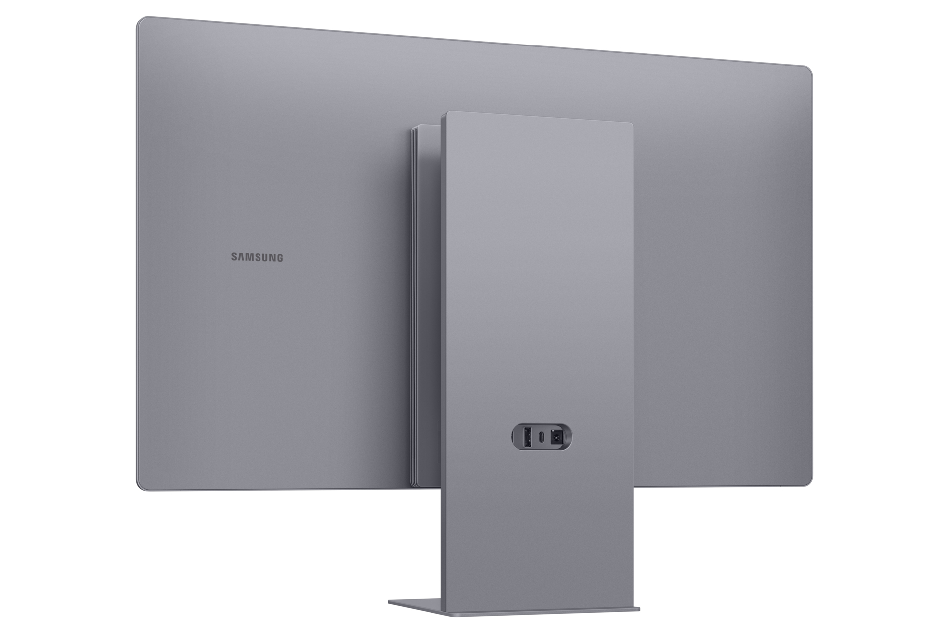 Tył szarego monitora Samsung, z logo marki i podstawą z portami.