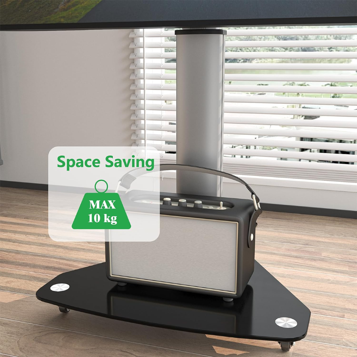 Haut-parleur noir sur support noir, avec étiquettes 'Space Saving' et 'MAX 10 kg'.
