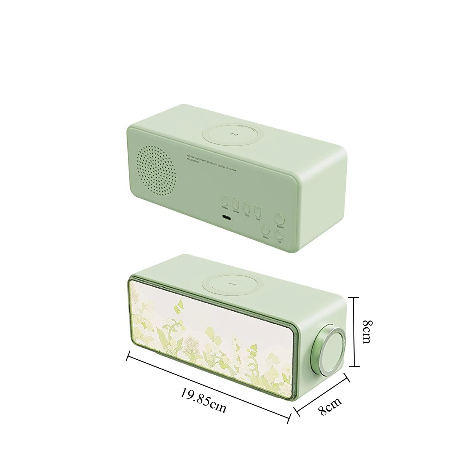 Ein mintgrüner Radiowecker mit kabellosem Aufladen und einem floralen Bildschirm.