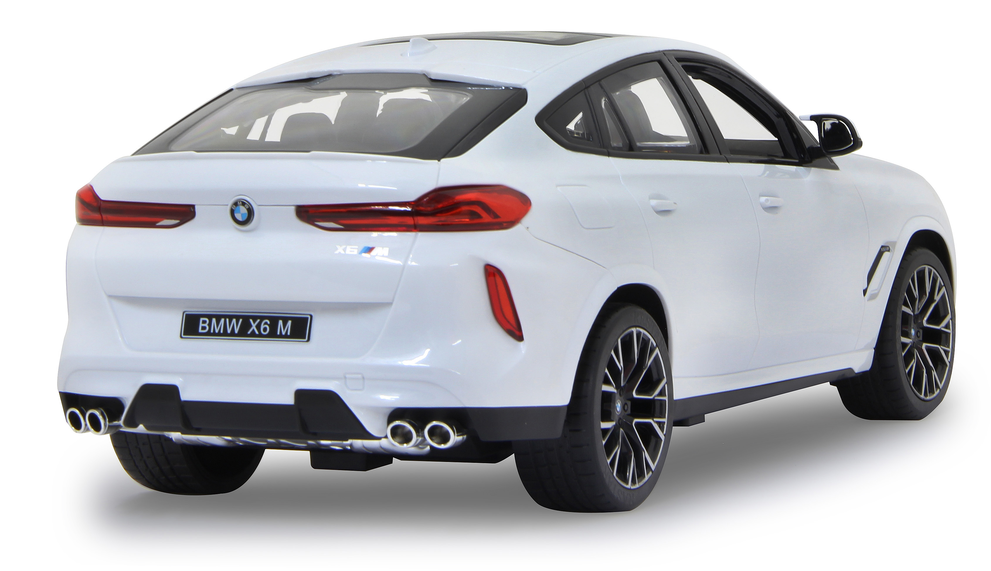 Weißes BMW X6 M Spielzeugauto, Rückansicht. Das Auto hat schwarze Räder und Akzente. Die Rücklichter sind rot.