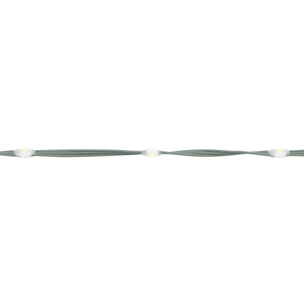 Nahaufnahme eines grünen Kabels mit drei kleinen weißen Lichtern. Die Lichter sind gleichmäßig verteilt.
