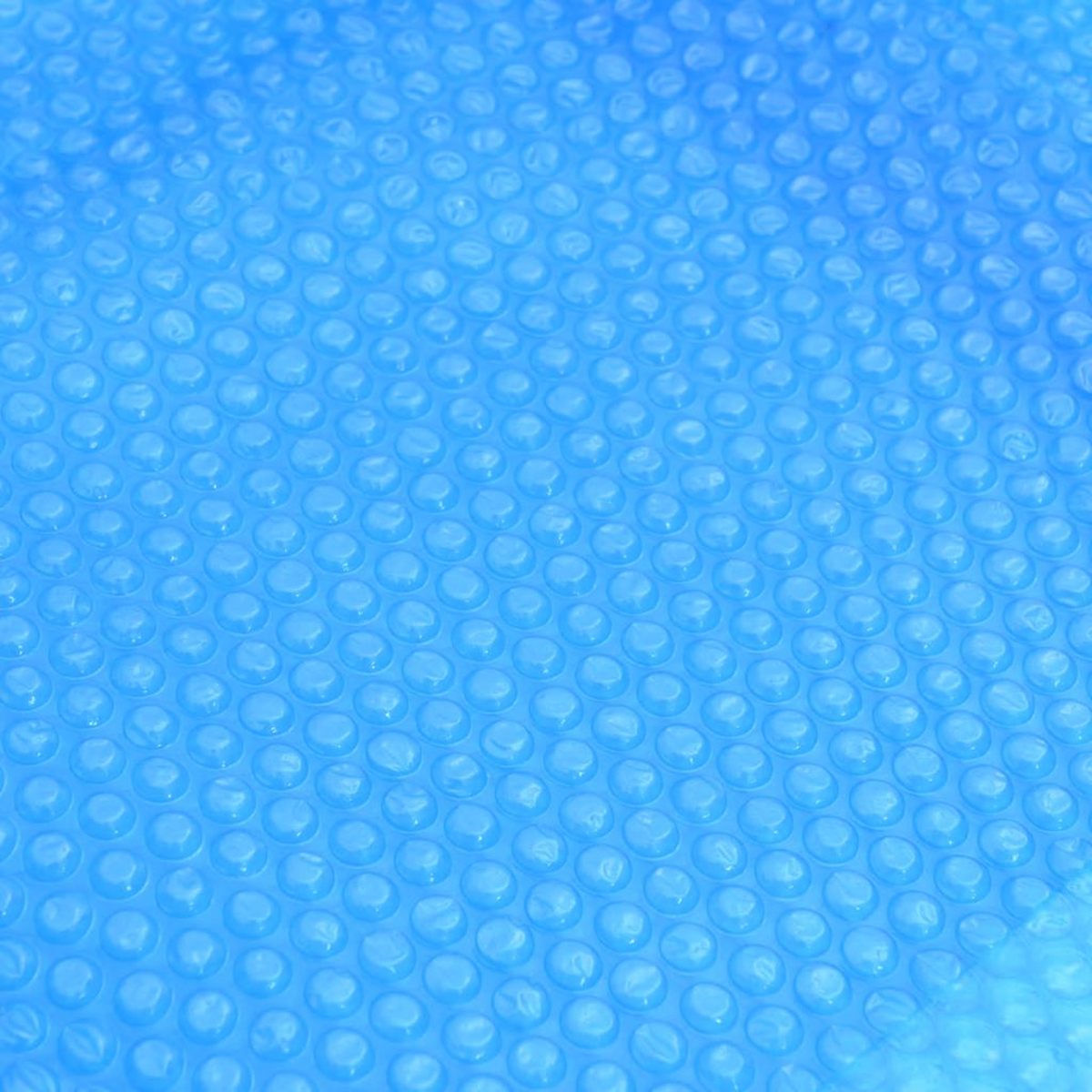 Nahaufnahme von blauem Kunststoff mit kleinen, blasenartigen, erhabenen Kreisen.