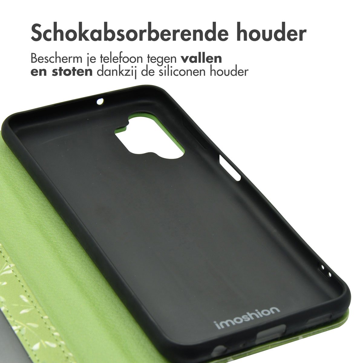 Intérieur de coque de téléphone noire avec le mot 'imoshion'. Il est à l'intérieur d'une coque à motif de feuilles vertes, sur fond blanc.