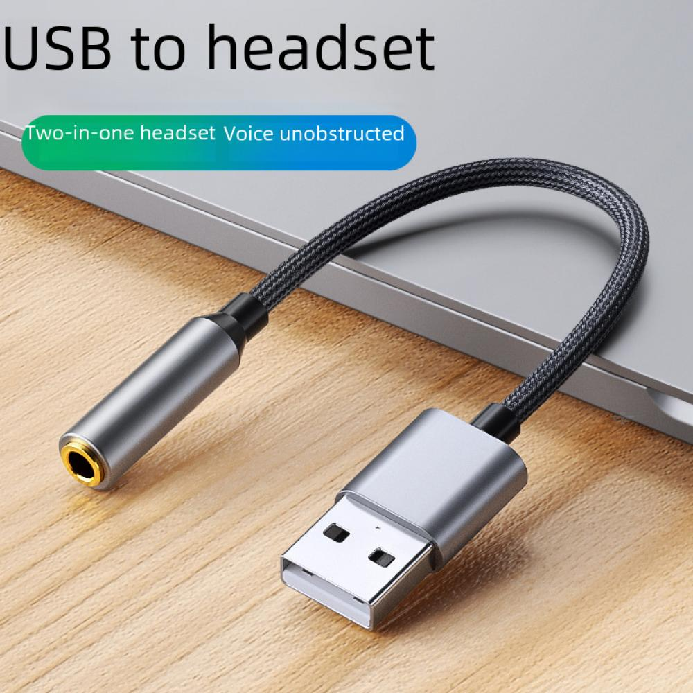 USB-zu-Headset-Kabel. Das Kabel und die Anschlüsse sind grau und schwarz. Es ist an einen Laptop angeschlossen.