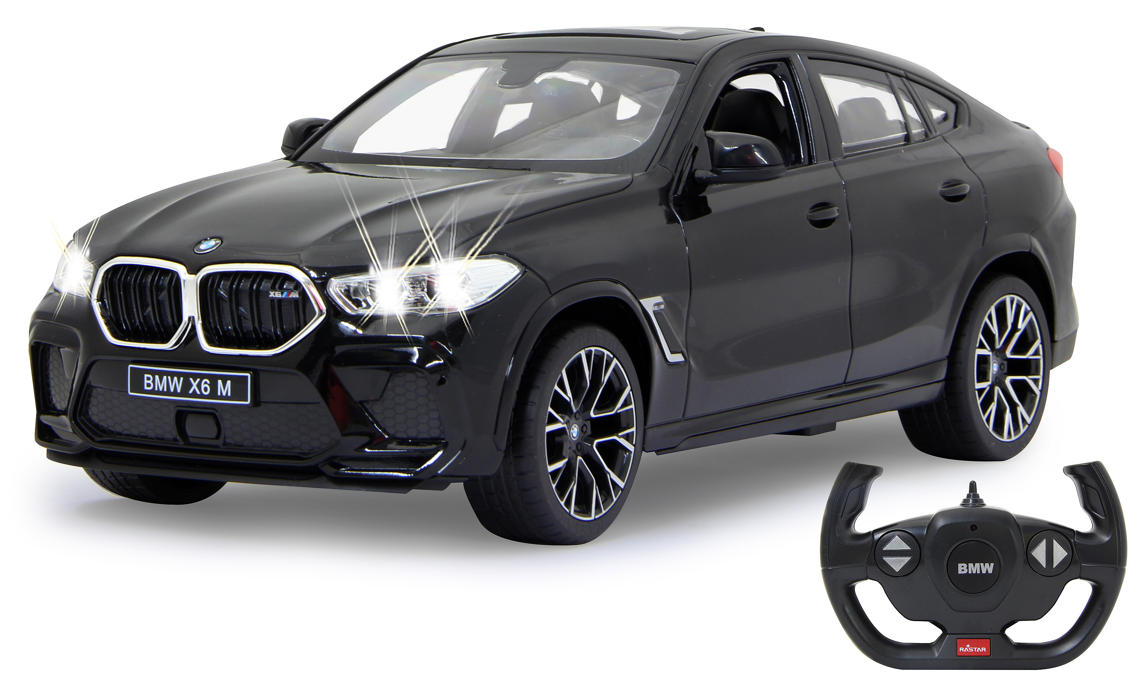 Ein schwarzes BMW X6 M Auto und eine Fernbedienung werden gezeigt. Die Scheinwerfer des Autos sind an.