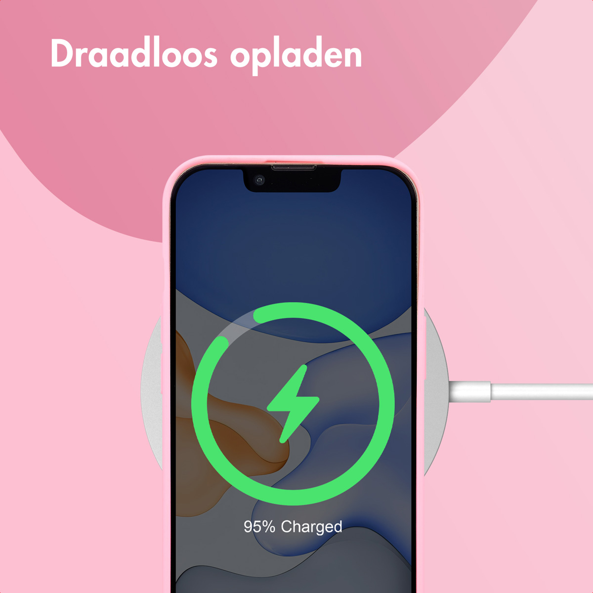 Phone charging wirelessly, showing a charging icon on the screen. Pink background.
