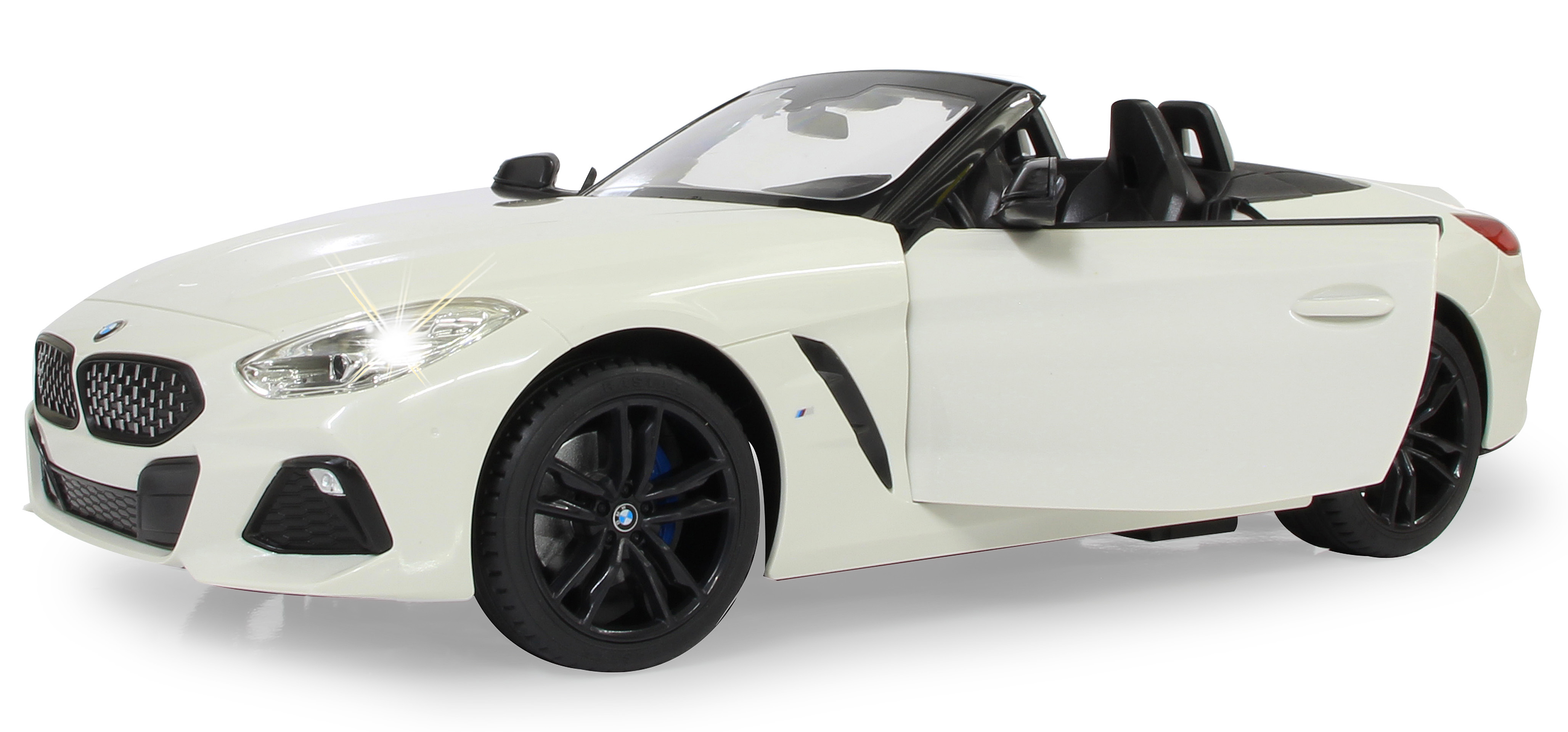 Weißes BMW Z4 Spielzeugauto mit offener Tür, Scheinwerfer an.
