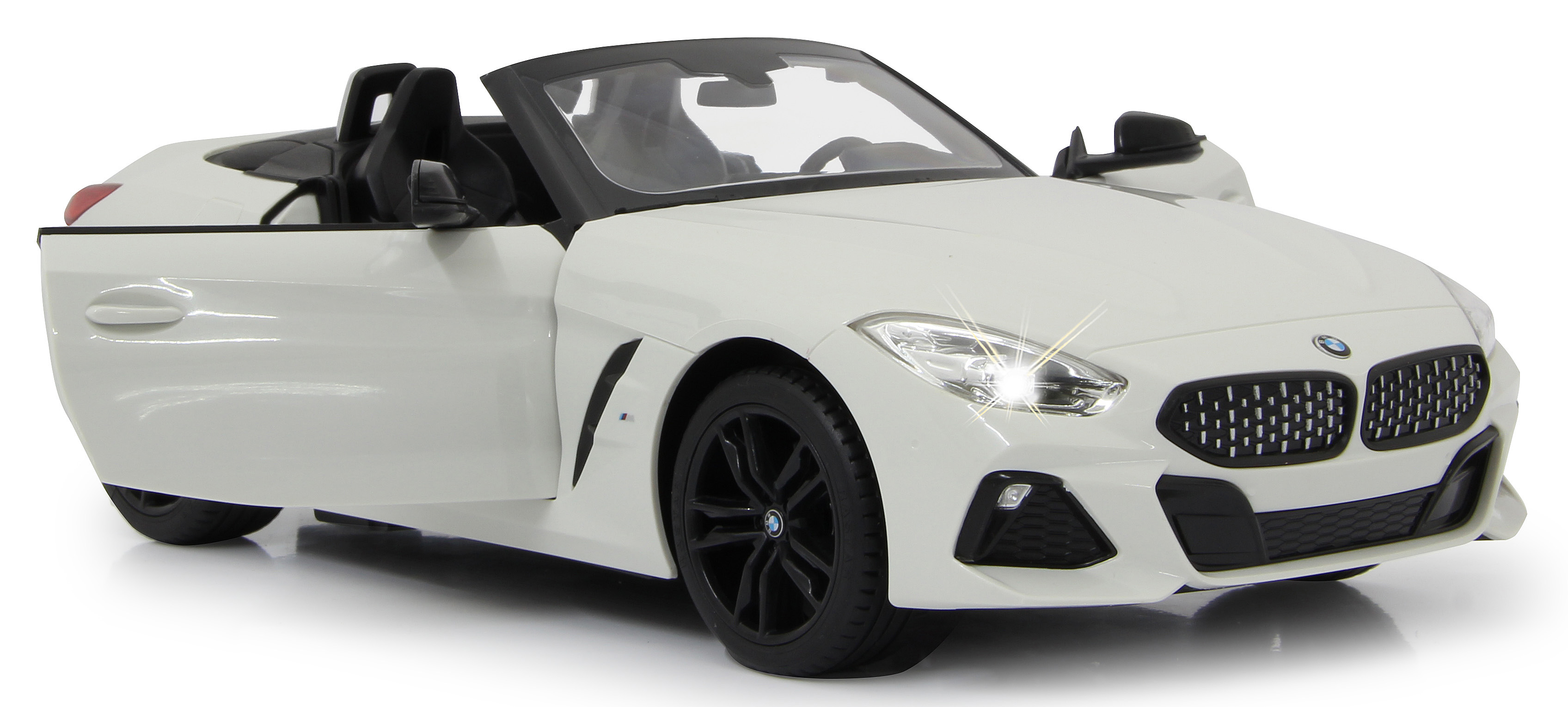 Weißes BMW Z4 Spielzeugauto mit offener Tür, Scheinwerfern an.