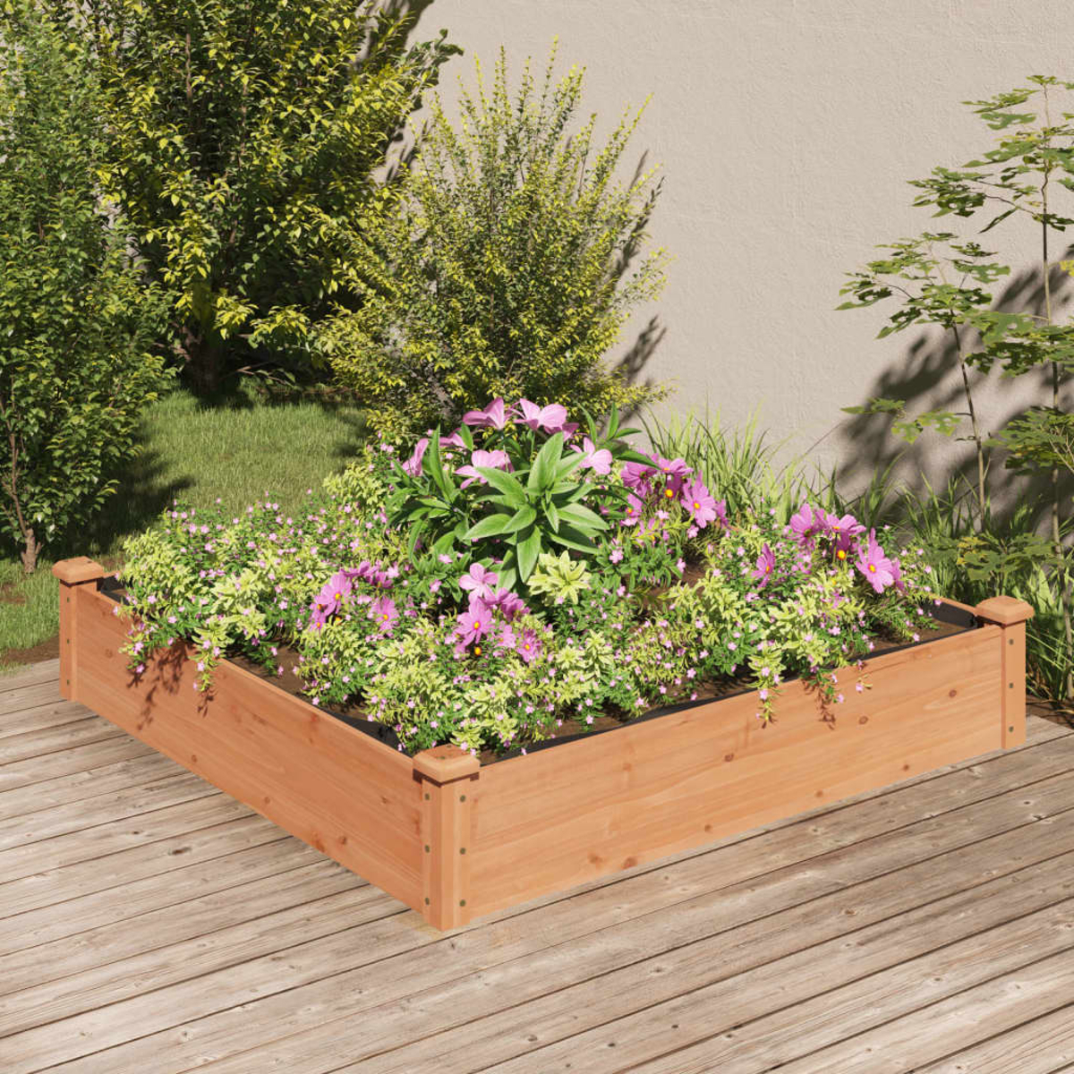 Hölzernes Gartenbeet mit Blumen und Pflanzen, auf Holzterrasse.