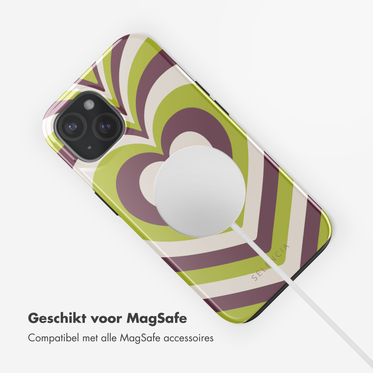 Een telefoon met een groen en paars hartdesign wordt opgeladen met een MagSafe-oplader.