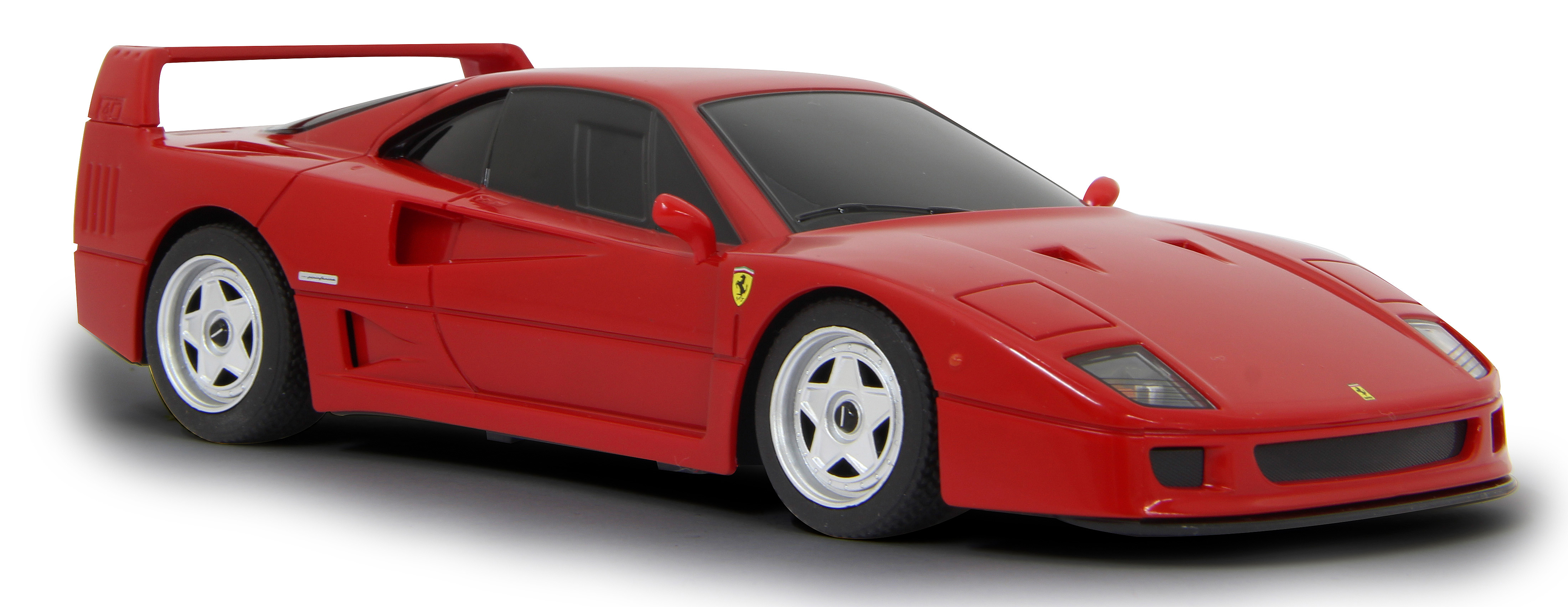 Rotes Ferrari F40 Spielzeugauto, Winkelansicht, auf weißem Hintergrund. Schwarze Reifen und weiße Räder sind sichtbar.