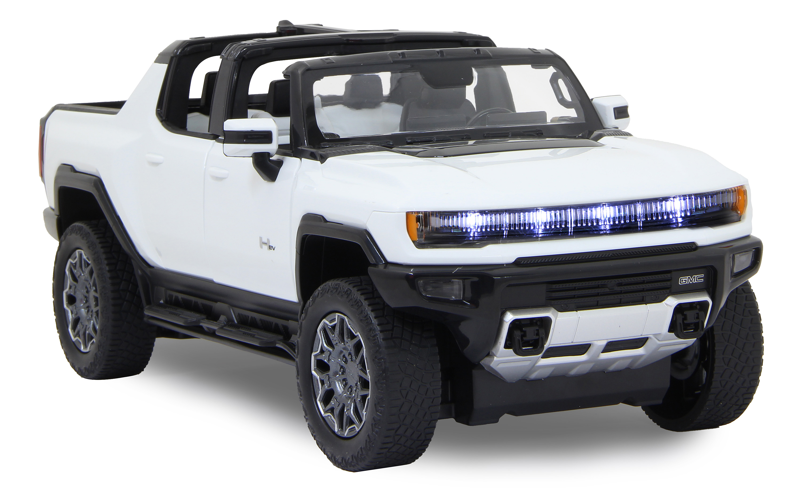 Weißer Spielzeug-Hummer EV. Schwarze Akzente, offenes Dach, GMC-Logo. Nach vorne gerichtet, Lichter an. Räder sichtbar.