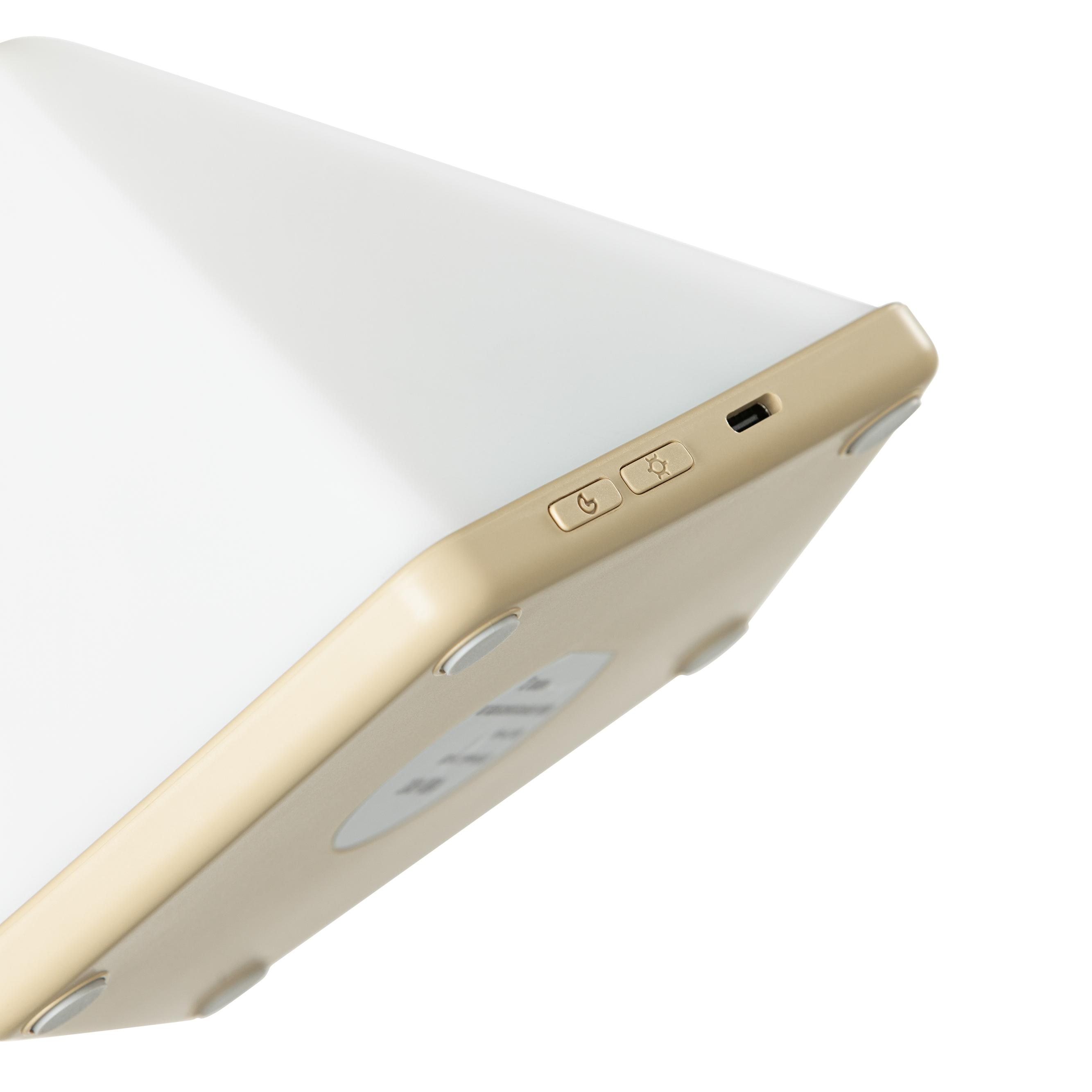 Nahaufnahme eines weißen und goldenen Geräts mit Knöpfen und einem kleinen USB-Anschluss.