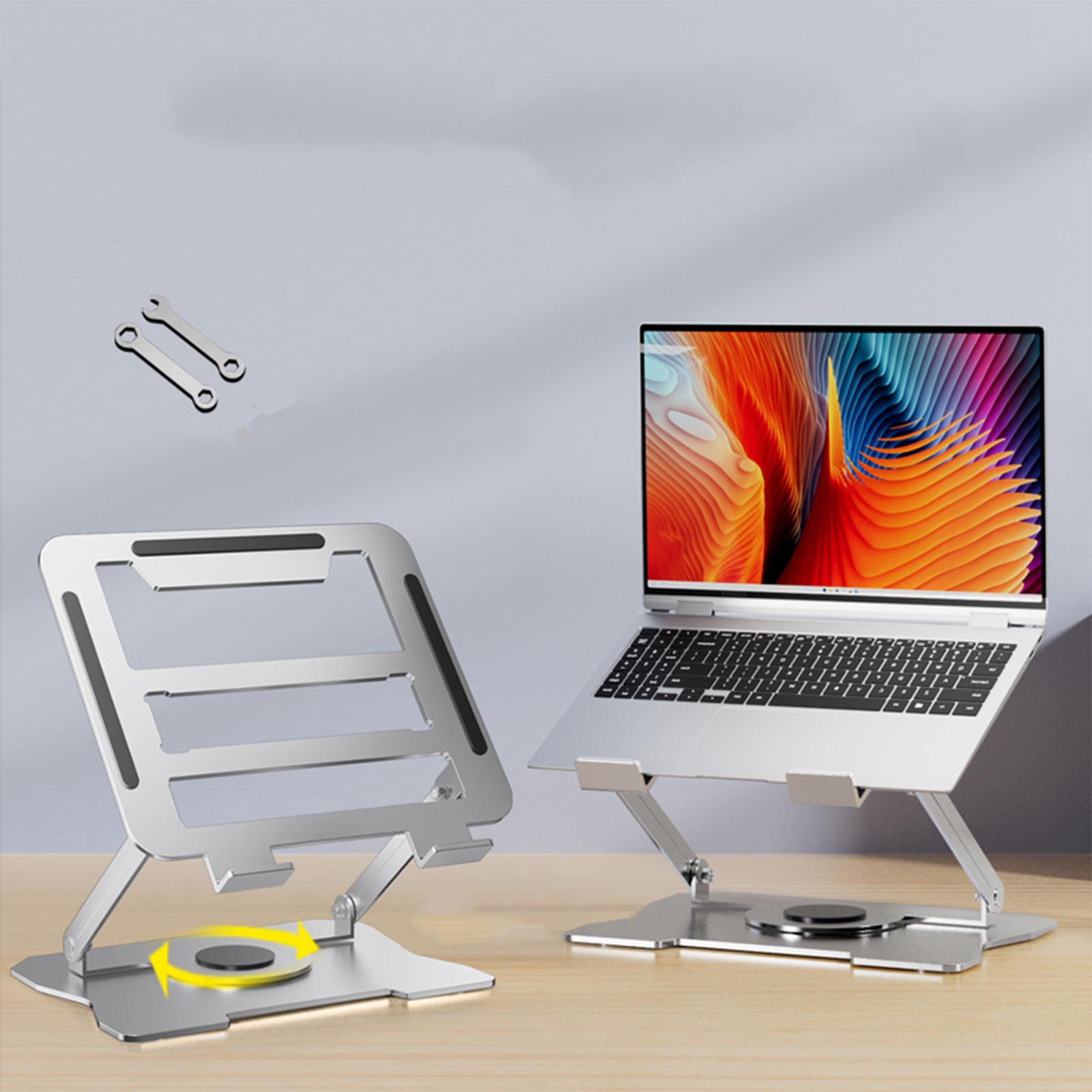Zwei silberne Laptopständer, einer mit Laptop. Schraubenschlüssel sind über den Ständern.
