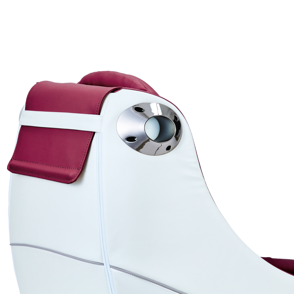 Close-up of a white and burgundy massage chair headrest. A chrome detail is visible.