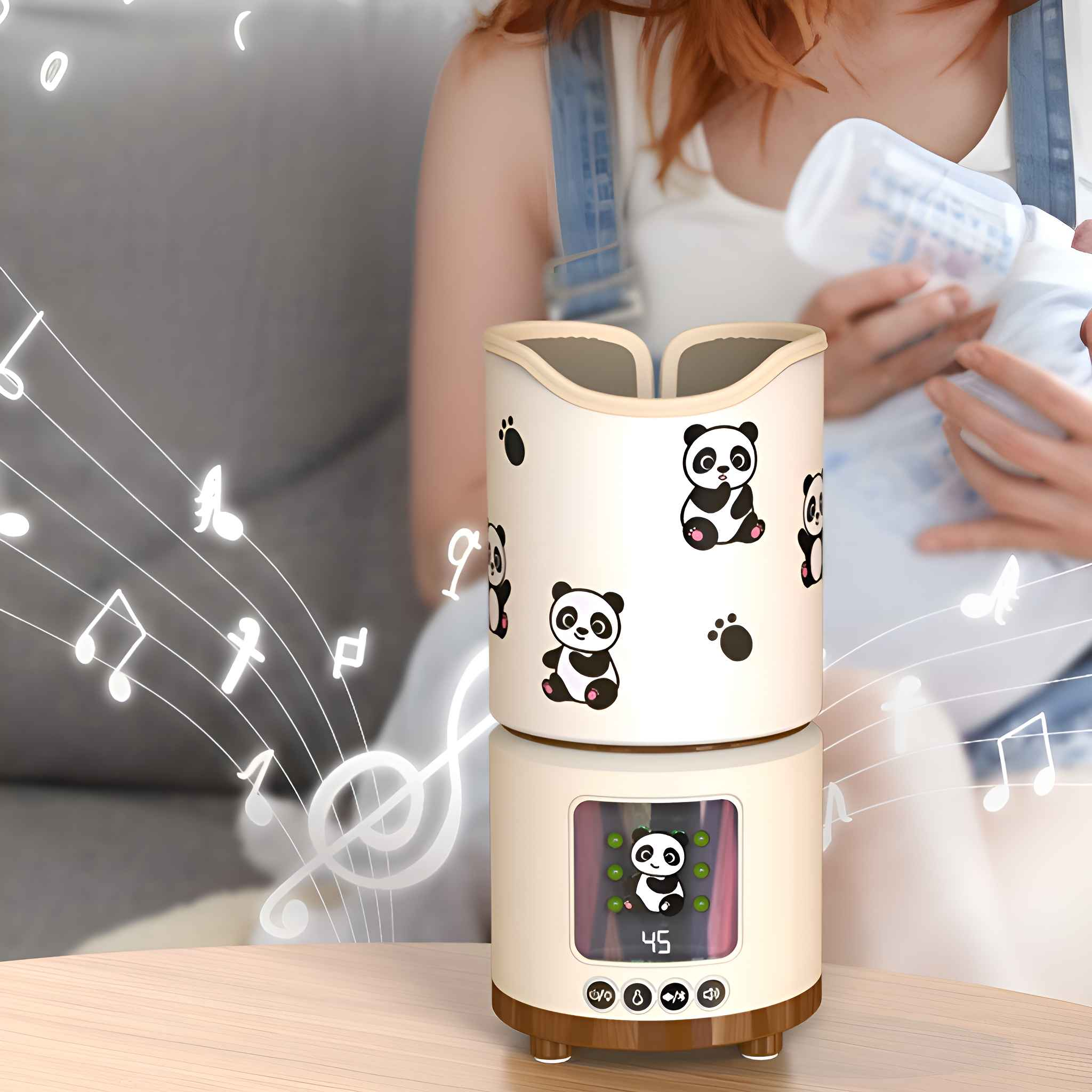 Ein weiß-braunes Gerät mit Panda-Grafiken. Eine Frau hält eine Babyflasche daneben. Noten im Hintergrund.