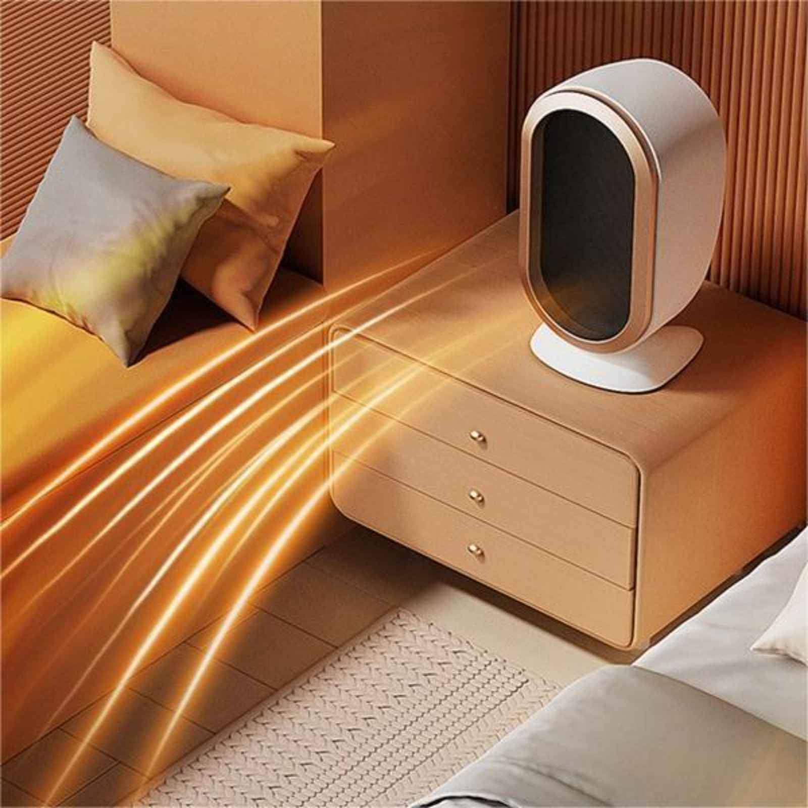 Heizung auf einem Nachttisch neben einem Bett. Orangefarbene Lichtstrahlen gehen aus.