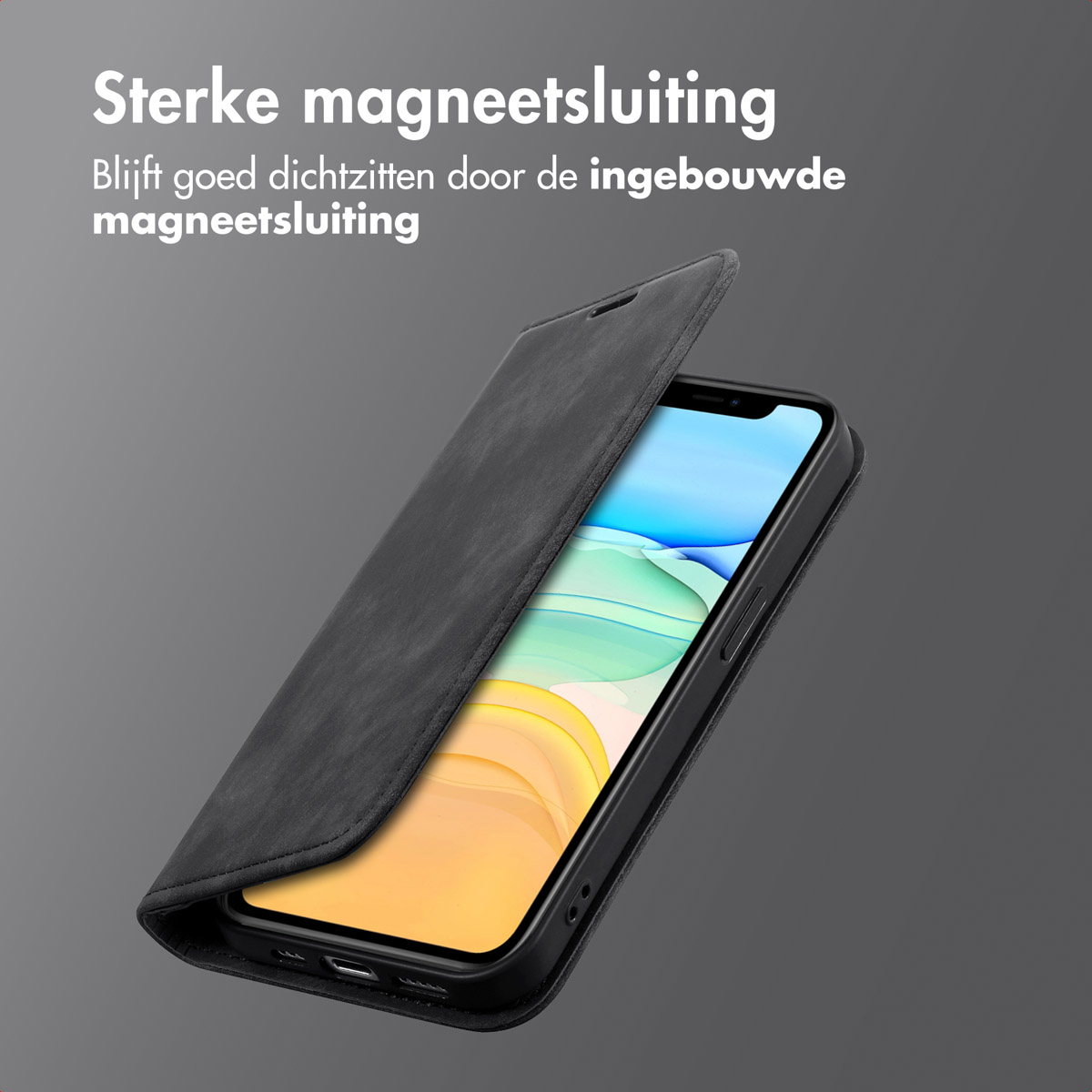 Une coque de téléphone ouverte. Téléphone à l'intérieur. Texte en néerlandais. Fond sombre.