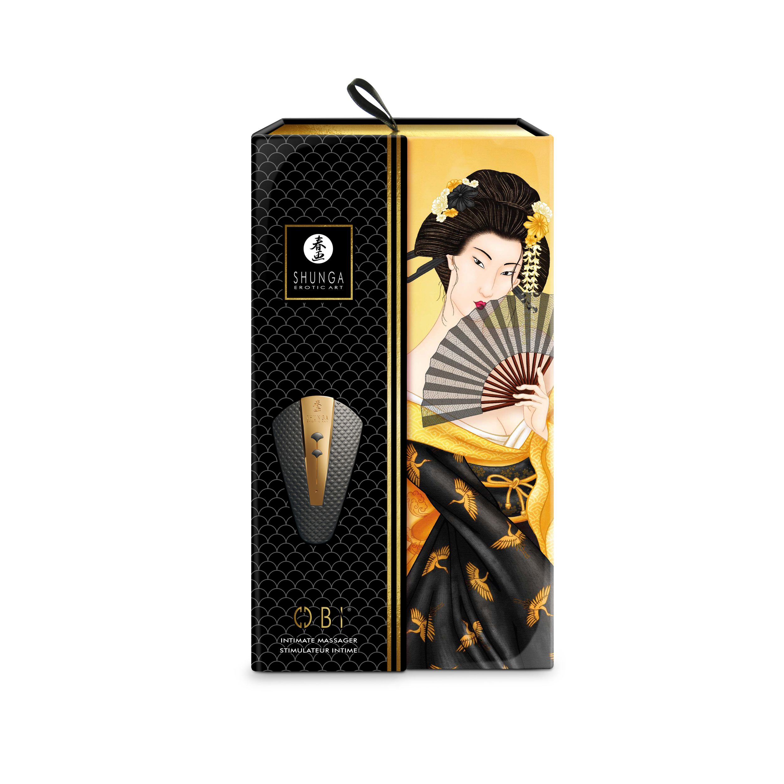 Vibrador negro y dorado junto a una caja con ilustración de geisha y texto.