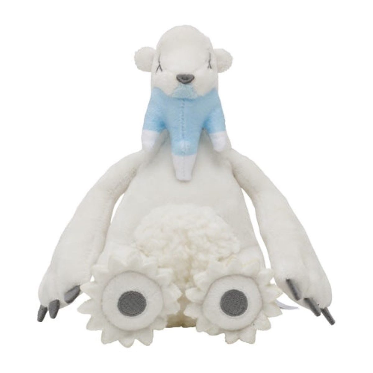 Ein weißes Plüschtier einer bärenartigen Figur mit einer kleinen blauen Figur auf dem Rücken.