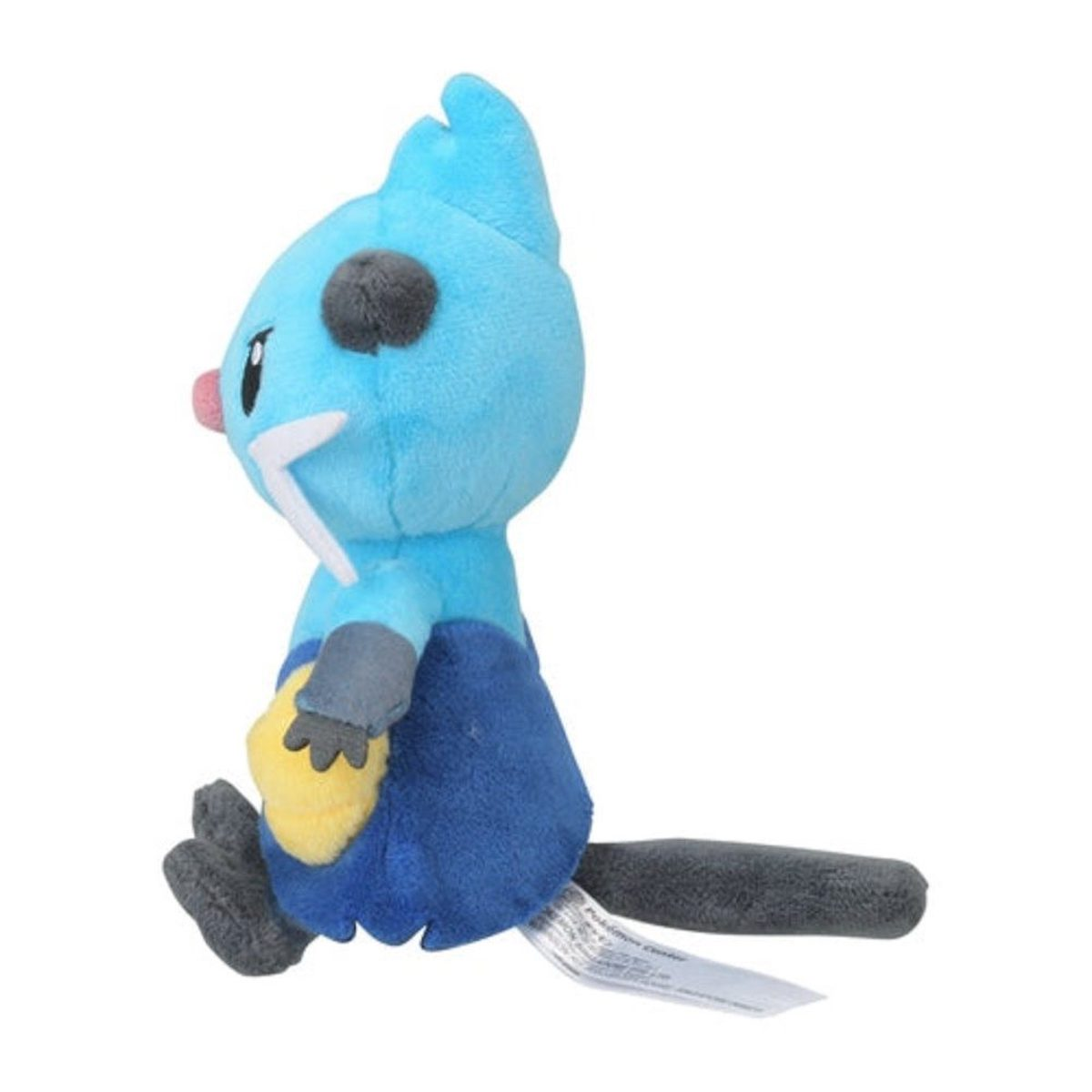 Ein blaues Plüschtier mit grauen Akzenten, das mit einem strengen Gesichtsausdruck sitzt.