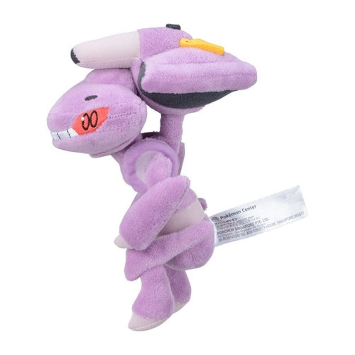 Ein lila Plüschtier mit gelbem Kopfschmuck und einem lächelnden Gesicht. Es ist ein Pokémon.