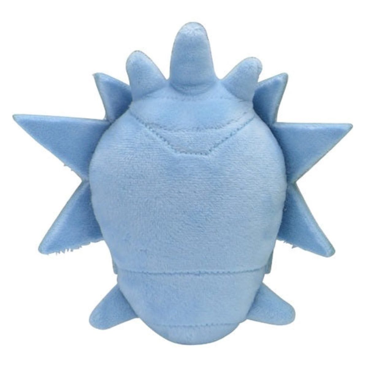 Ein hellblaues Plüschtier mit stacheligem Design, das einem Meeresbewohner ähnelt, von oben gesehen.