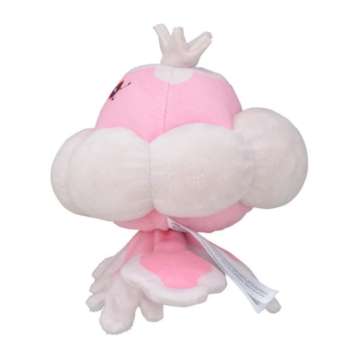 Ein rosa-weißes Plüschtier von der Seite, mit Wolken-Design und Anhänger.