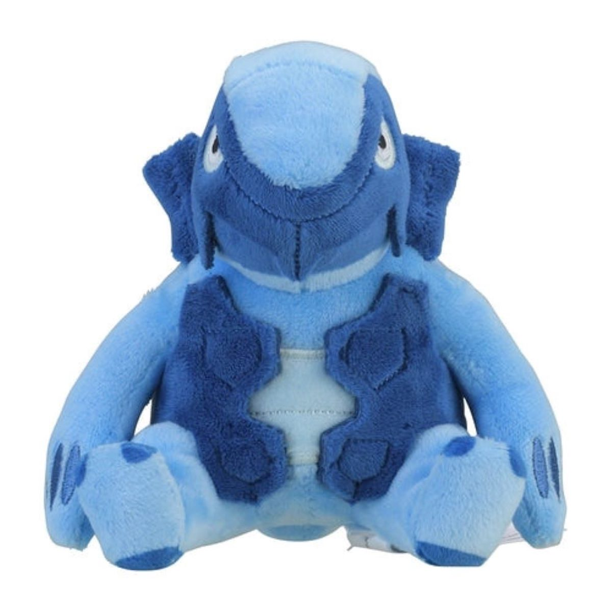 Ein blaues Plüschtier einer schildkrötenartigen Kreatur, die sitzt. Es hat große Gliedmaßen.