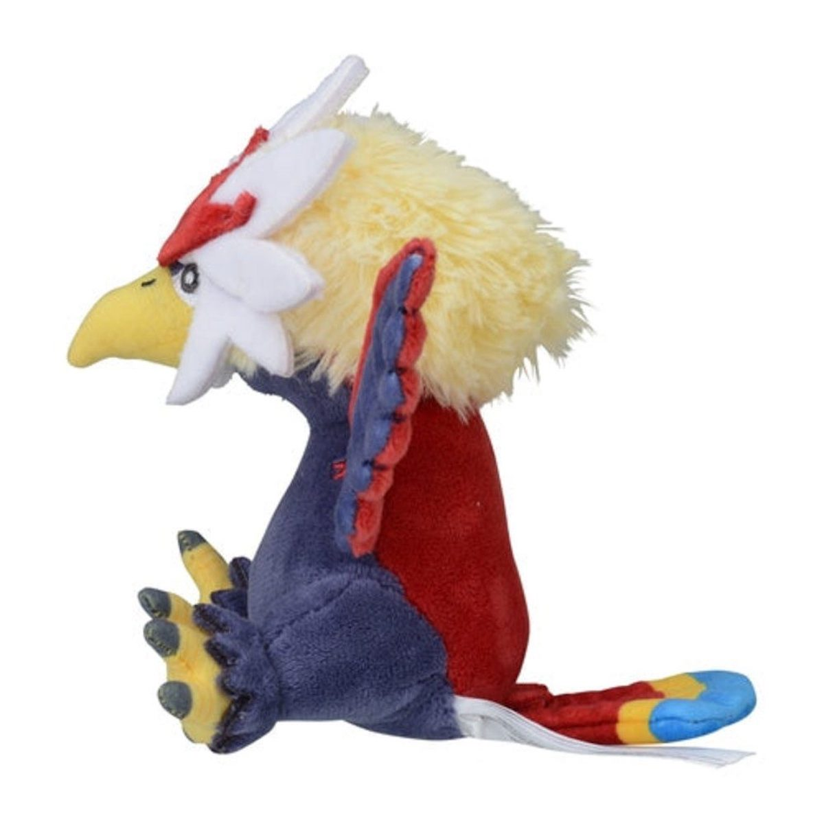 Ein Plüschvogel im Profil mit gelbem Kopf, roten und blauen Flügeln und rotem Schwanz auf weißem Hintergrund.