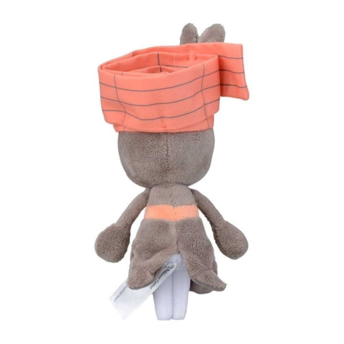 Eine Plüschfigur von hinten, grauer Körper, orangefarbene Kopfbedeckung und ein weißes Etikett hinten.