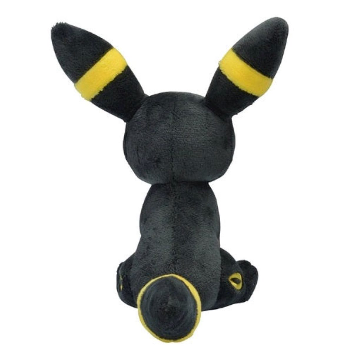 Ein schwarzes Umbreon-Plüschtier von hinten, mit gelben Akzenten an Ohren und Schwanz.