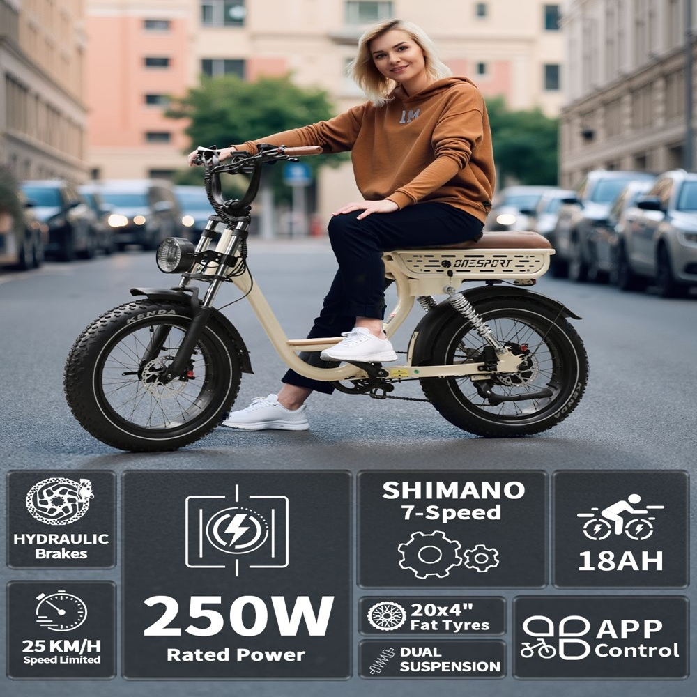 Mujer en e-bike crema. Características: 250W potencia, neumáticos anchos, doble suspensión, control app.