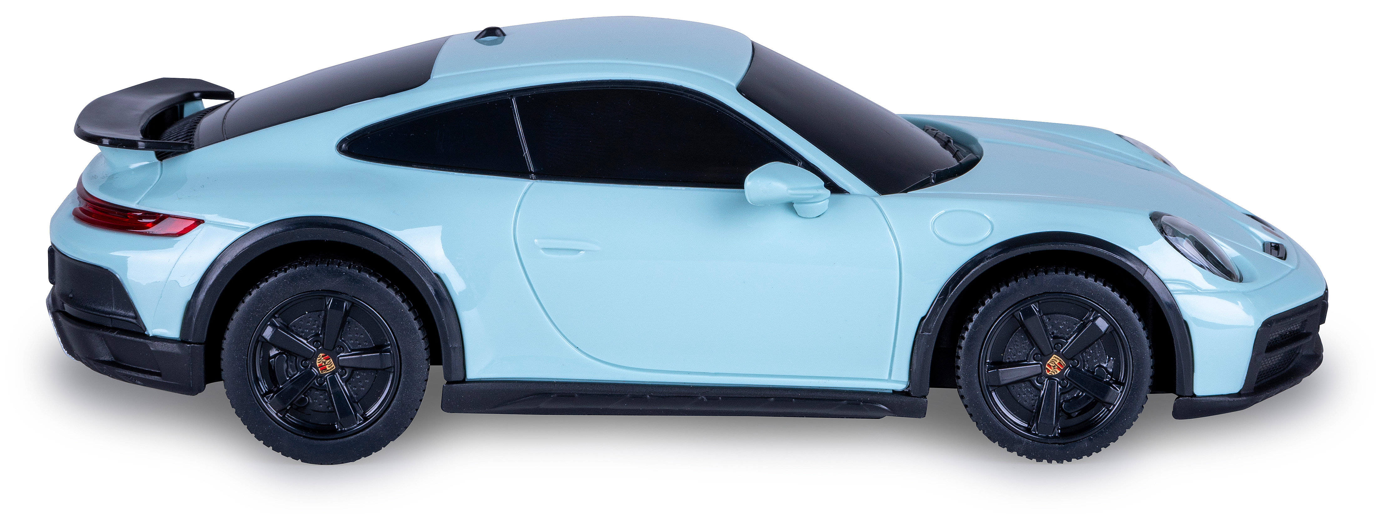Seitenansicht eines hellblauen Spielzeug-Porsche 911 Dakar. Schwarze Räder, Details und Zierleisten sichtbar.