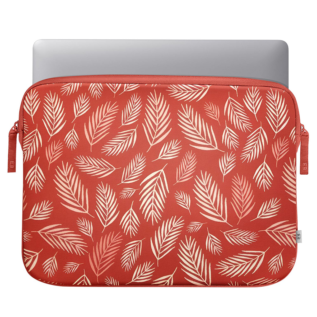 A laptop in a red leaf pattern sleeve, top view on white.