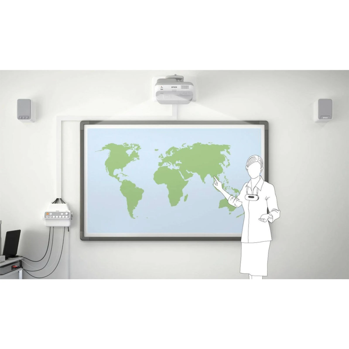 A woman points at a world map on a whiteboard. Overhead projector and speakers are mounted.